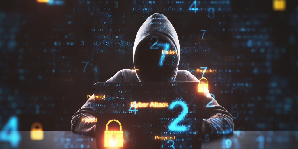 Hacker vor Laptop, graphisch eingefügtes Schloss, das Sicherheit darstellt